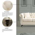 Beige velvet three-seater sofa with rolled-up armrests and rivet decorations; seats 3 people.