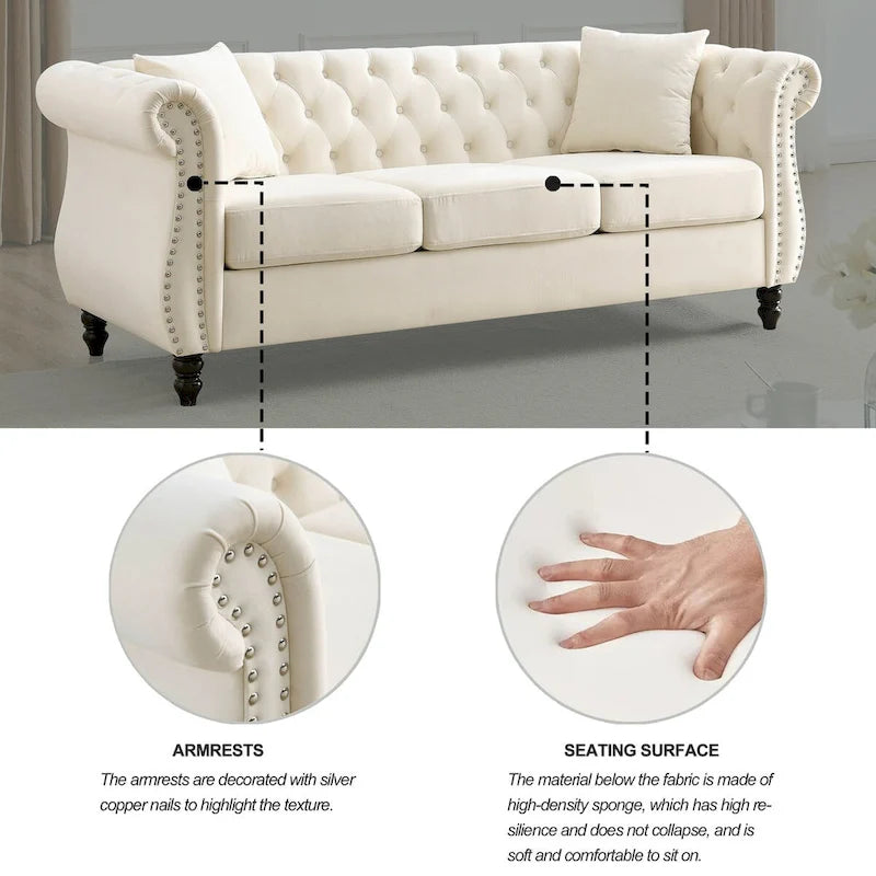 Beige velvet three-seater sofa with rolled-up armrests and rivet decorations; seats 3 people.