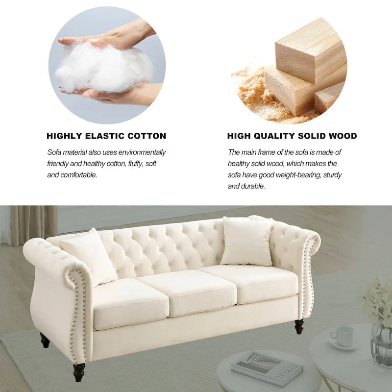 Beige velvet three-seater sofa with rolled-up armrests and rivet decorations; seats 3 people.